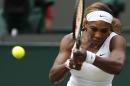 Serena Williams of U.S. plays a return to Chanelle Scheepers of South Africa during their women's singles match at the All England Lawn Tennis Championships in Wimbledon, London, Thursday, June 26, 2014. (AP Photo/Ben Curtis)