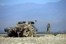 US soldier inspects the site of a suicide attack targeting foreign troops in Jalalabad on November 13, 2014