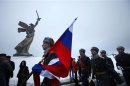 Russian soldiers march at the Mamayev Kurgan (Mamayev Hill) World War Two memorial complex, with the statue of Mother Homeland in the background during celebrations in the city of Volgograd