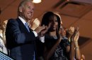 U.S. Vice President Biden and first lady Michelle Obama applaud as they watch from the first lady's box during the second session of the Democratic National Convention in Charlotte