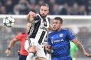 Juventus' Gonzalo Higuain, left, and Lyon's Corentin Tolisso go for the ball during a Champions League, Group H soccer match between Juventus and Lyon at the Juventus Stadium in Turin, Italy, Wednesday, Nov. 2, 2016. (Alessandro Di Marco/ANSA via AP)