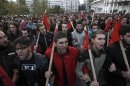 Greek students shout slogans during a rally in Athens
