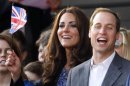Britain's Catherine, Duchess of Cambridge watches with Prince William during the Diamond Jubilee concert in front of Buckingham Palace in London