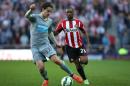 Newcastle United's defender Daryl Janmaat (L) vies with Sunderland's striker Jermain Defoe during the English Premier League football match in Sunderland on April 5, 2015