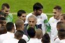 Algeria's head coach Vahid Halilhodzic, center, speaks to players before an official training session the day before the group H World Cup soccer match between South Korea and Algeria at the Estadio Beira-Rio in Porto Alegre, Brazil, Saturday, June 21, 2014. (AP Photo/Lee Jin-man)