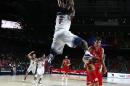 United States' Kenneth Faried, centre, dunks during the final World Basketball match between the United States and Serbia at the Palacio de los Deportes stadium in Madrid, Spain, Sunday, Sept. 14, 2014. (AP Photo/Andres Kudacki)