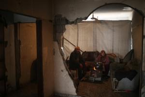 A Palestinian woman prepares food with her husband &hellip;