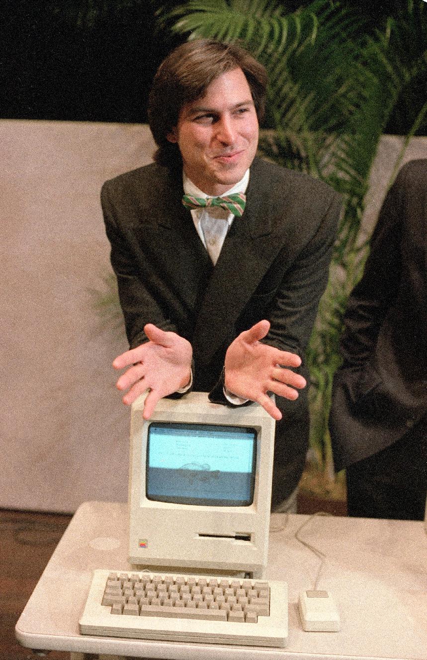 1984 - Steve Jobs, chairman of the board of Apple Computer, leans on
 the new
