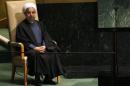 Iranian President Hassan Rouhani sits in a chair reserved for heads of state before his address to the 69th United Nations General Assembly at United Nations Headquarters in New York