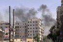 Smoke billows from the Salaheddin district of the northern Syrian city of Aleppo