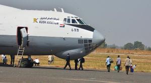 Sudanese citizens board a plane back to Khartoum after …
