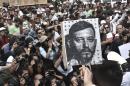 Mexican photojournalists hold pictures of their murdered colleague Ruben Espinosa during a demostration in Mexico City, on August 2, 2015