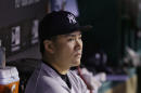 New York Yankees starting pitcher Masahiro Tanaka watches from the dugout after leaving the game in the seventh inning of a baseball game against the Cleveland Indians Tuesday, July 8, 2014, in Cleveland. Tanaka pitched 6 2/3 innings and gave up 10 hits and five runs. (AP Photo/Tony Dejak)