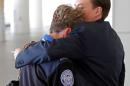 TSA employees console each other at LAX on Nov. 1.