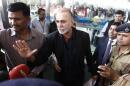 Tarun Tejpal speaks with the media upon his arrival at the airport on his way to Goa, in New Delhi