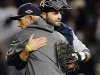 Detroit Tigers catcher Alex Avila hugs manager Jim Leyland after their 3-0 win over the New York Yankees in Game 2 of baseball's American League championship series, Sunday, Oct. 14, 2012, in New York. (AP Photo/The Record of Bergen County, Tyson Trish) ONLINE OUT; MAGS OUT; TV OUT; INTERNET OUT; NO ARCHIVING; MANDATORY CREDIT
