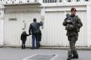A French soldier secures the access to a Jewish school in Paris