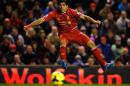 Liverpool's Uruguayan striker Luis Suarez shoots towards goal at Anfield in Liverpool, northwest England on December 4, 2013