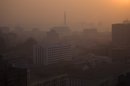 In this April 22, 2013 photo, the sun rises over Juche Tower in Pyongyang, North Korea. (AP Photo/David Guttenfelder)