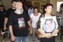 Relatives of victims of a munitions explosion in Cyprus in 2011 emerge from a courthouse in the coastal town of Larnaca