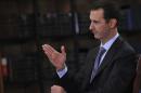 Syria's President Bashar al-Assad speaks during an interview with Italian television station RaiNews24 in Damascus