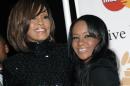 FILE - In this Feb. 12, 2011, file photo, singer Whitney Houston, left, and daughter Bobbi Kristina Brown arrive at an event in Beverly Hills, Calif. The daughter of late singer and entertainer Whitney Houston was found Saturday, Jan. 31, 2015, unresponsive in a bathtub by her husband and a friend and taken to an Atlanta-area hospital. The incident remains under investigation. (AP Photo/Dan Steinberg, File)
