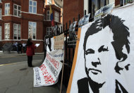 Placards and messages placed by supporters of WikiLeaks founder Julian Assange, are seen outside the Ecuador Embassy, London, Friday, June 29, 2012. Assange had entered the embassy in an attempt to gain political asylum to prevent him from being extradited to Sweden to face allegations of sex crimes, which he denies. (AP Photo/Lefteris Pitarakis)