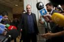Greek Finance Minister Varoufakis arrives to make a statement to the media after meeting with Spanish Economy Minister Luis de Guindos in Madrid