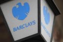 A lamp featuring a logo of Barclay's bank is seen outside a branch in London