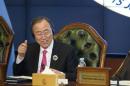 UN Secretary-General Ban gives a thumbs up sign at the end of a conference in Kuwait