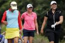 Hee Young Park of Korea, left, Stacy Lewis, center, and Caroline Hedwall of Sweden laugh while making their way to hole 7 during the second round of the LPGA's CME Group Tour Championship golf tournament, Saturday, Nov. 22, 2014 at Tiburon Golf Club in Naples, Fla.. (AP Photo/Naples Daily News, Corey Perrine) FORT MYERS OUT