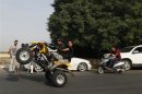 Iraqi bikers perform during a biker show on Abu Nawas Street in Baghdad