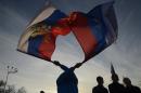 Pro-Russian demonstrators take part in a rally in the Crimean town of Yevpatoria