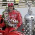 Indianapolis 500 champion IndyCar driver Dario Franchitti, of Scotland, poses in his car during the traditional winner photo session at the Indianapolis Motor Speedway in Indianapolis, Monday, May 28, 2012.  (AP Photo/Michael Conroy)