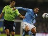 Manchester City's Tevez challenges Aston Villa's Lichaj during their English League Cup soccer match at The Etihad Stadium in Manchester