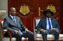 Newly appointed Vice President of South Sudan, Taban Deng Gai (L) and South Sudan's President Salva Kiir (R) pose at State House, in Juba on July 26, 2016