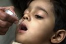 A Pakistani child receives anti-polio vaccine drops