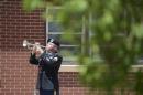 Staff Sgt. Luis Ortiz plays taps at Provider's Chapel at Fort Carson, Colo. Tuesday, June 10, 2014, during a memorial service for Pfc. Jacob H. Wykstra. Wykstra died last month in a helicopter crash in Afghanistan. (AP Photo/The Gazette, Mark Reis)