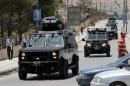 Jordanian security vehicles seen near the General Intelligence directorate offices near al Baqaa Refugee Camp