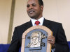 FILE - In this July 22, 2012, file photo, former Cincinnati Reds star Barry Larkin holds his plaque after his induction into the National Baseball Hall of Fame and Museum during a ceremony in Cooperstown, N.Y. Larkin wants to keep baseball's most exclusive club clean.  Inducted into the Hall of Fame last summer, he told The Associated Press in a phone interview Wednesday, Dec. 5, 2012, that players who cheat shouldn't receive baseball's highest individual honor. (AP Photo/Tim Roske, FIle)