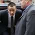 Former England soccer captain and Chelsea player John Terry, center, arrives at Westminster Magistrates Courts in London, Tuesday, July 10, 2012. The racism trial of Terry began Monday with prosecutors claiming the Chelsea captain acknowledges using offensive language as a "sarcastic exclamation" in response to taunts that he allegedly had an affair. The England defender is accused of racially abusing Queens Park Rangers defender Anton Ferdinand, who is black, during a Premier League match in October.  (AP Photo/Sang Tan)