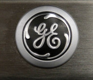 <p>               FILE - In this Monday, Sept. 10, 2012 file photo, a General Electric logo is seen on a kitchen stove at a Lowe's store in Framingham, Mass. General Electric Co. is reporting, Friday, Jan. 18, 2013, that net income rose 8 percent in the fourth quarter as earnings at all of the conglomerate's industrial segments improved due to growth in developing economies. (AP Photo/Steven Senne, File)