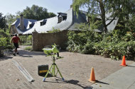 A worker walks into the house of Steve Jobs in Palo Alto, Calif., Friday, Aug. 17, 2012. Kariem McFarlin, 35, was arrested on Aug. 2, 2012 and accused of breaking into the Jobs home and stealing iPods, Macs, jewelry and Jobs' wallet on July 17, 2012, investigators said. (AP Photo/Paul Sakuma)