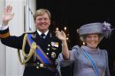 File photo showing Netherlands' Beatrix and her son Crown Prince Willem-Alexander waving to well-wishers from the balcony of the Royal Noordeinde Palace after opening the new parliamentary year in The Hague