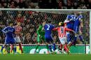 Chelsea's John Terry (26) heads the ball to score against Stoke during the English Premier League soccer match between Stoke City and Chelsea at the Britannia Stadium, in Stoke on Trent, England, Monday, Dec. 22, 2014. (AP Photo/Rui Vieira)