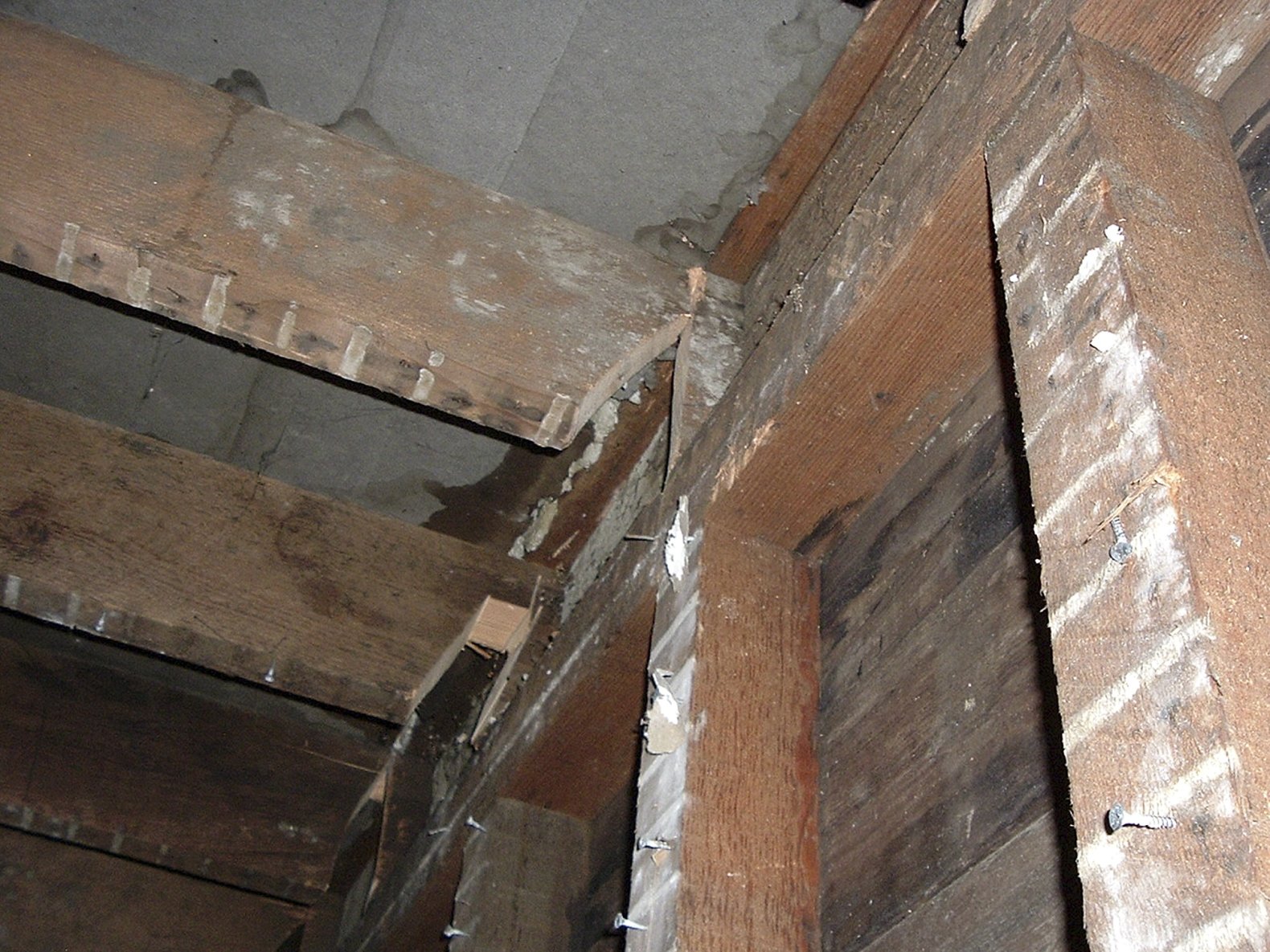 This undated photo released by the San Francisco Office of the District Attorney shows cut joists under the floor of a San Francisco apartment. A couple prosecutors dubbed the “landlords from hell” for going to scary lengths to drive tenants from a San Francisco apartment building has pleaded guilty to several felonies. Prosecutors said Wednesday that 37-year-old Nicole Macy and 38-year-old Kip Macy threatened to shoot tenants, changed locks, cleared apartments of belongings, and sawed holes in floors, all in an attempt to drive renters out of their building in the increasingly pricey South of Market neighborhood. (AP Photo/San Francisco Office of the District Attorney)