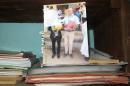 Personal documents and a picture of French priest Georges Vandenbeusch (R) in the house where he lived in Nguetchewe, near Maroua, in the north of Cameroon on November 17, 2013