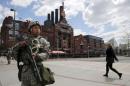 National Guard troops patrol in front of the Power Plant in the Inner Harbor of Baltimore