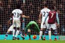 Crystal Palace keeper Wayne Hennessey, center, fails to stop the ball and Aston Villa's Joleon Lescott, not pictured, from scoring during the English Premier League soccer match between Aston Villa and Crystal Palace at Villa Park, Birmingham, England, Tuesday, Jan. 12, 2016. (AP Photo/Rui Vieira)