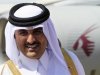 Qatar's Crown Prince Sheikh Tamim smiles during his arrival for an economic ties visit at Khartoum Airport